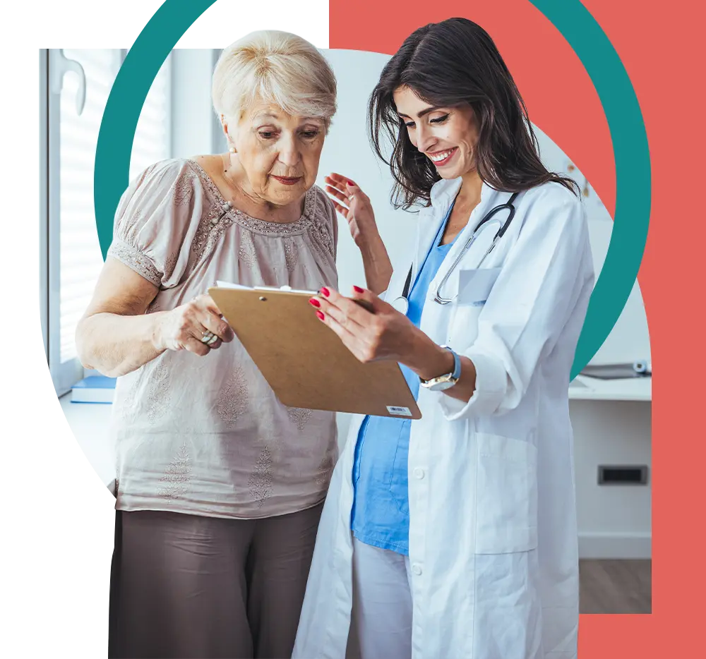 Provider and polychronic patient reviewing a patient chart 